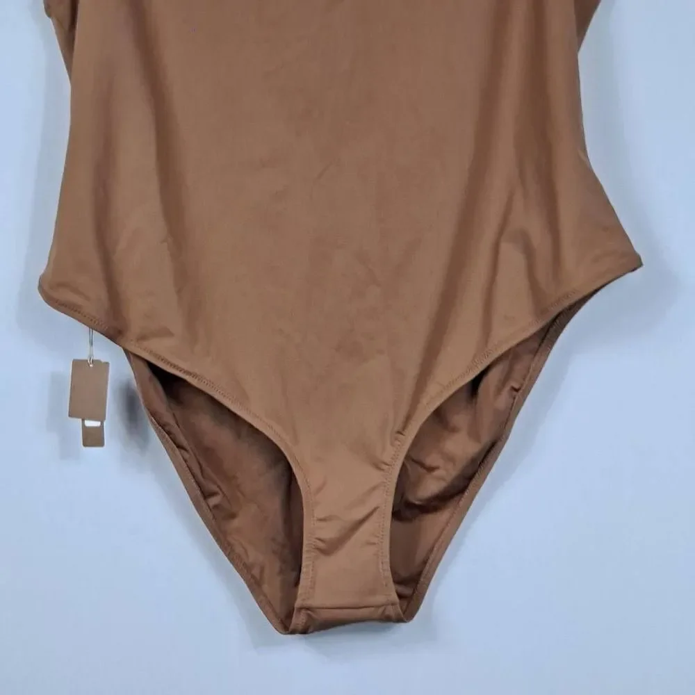 SKIMS Swim mock neck cycle suit. NWT‎